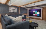 Lower level home theater with Roku Smart TV setup 